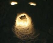 tonight in the dooryard.nKiki &amp; I light the face we carvedninto the snow bank. Looks likensomeone we know,,,so life like,,nsong is