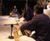 This is an excerpt from the Tarz Group performance at the Indus Valley School of Art and Architecture in February of 2012. This is a rhythm segment composed by Yousuf Kerai. The musicians are Yousuf Kerai (stage left) on tabla, Zoeb Hussain (stage right) on tabla and Mohd. Siraj (center) on Dholak. The composition is in an 8-beat cycle called Keherwa and has rhythmic phrases that demonstrate the various grooves that can be generated within the cycle. The piece ends with a Thihai, which is a rhyt