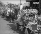 NFSA title:14250nA Peace Day Parade at Woonona in New South Wales on 19 July 1919, claimed to be the best procession in the state outside of Sydney.nnVisible in this clip are: Mrs Conly, dressed as the Goddess Britannia, followed by the Woonona Agricultural Bureau float carrying Miss M Burrows dressed as Ceres, the Goddess of Agriculture, standing next to Miss Moore wearing a costume depicting the Goddess of Peace. Both women are seen here surrounded by produce. nnPrizes were given at Woonona fo