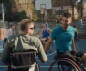 Transcript -n[Dylan Alcott watches a film crew. Cruising onto a wheelchair basketball court, he greets players. A film crew applaud a teenage performer who&#39;s rugged-up in cold-weather gear. On a low stage, her wheelchair perches on a snowy mound. A woman with prosthetic legs performs on a set of an ANZ foyer. A presenter wearing only Bonds underwear communicates with the crew through an Auslan interpreter. A young brunette and her guide dog move before a green screen. Behind the screens, the tee