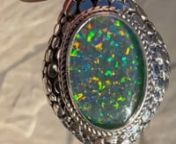I like the flash of color when the light shines at different angles. I can mix with other gemstone colors. It is very difficult to photograph opals i do see red, orange, yellow, blue and green depending on how the light shines on the opal. The silverwork and weight of the pendent is substantial. Very happy with my purchase.nn==&#62;https://www.sarda.com/product/sterling-silver-scattered-jawan-gilson-simulated-opal-triplet-pendant-enhancer/