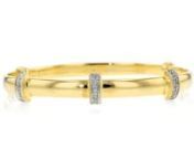 https://www.ross-simons.com/864694.htmlnnFeminine, chic and ultra-versatile, this 14kt yellow gold over sterling silver bangle bracelet is adorned with three stations of diamond accents for a simple but significant detail that will delight. Expands slightly to easily slip on and off. Fits 7