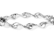 https://www.ross-simons.com/487318.htmlnnOur bangle is a pretty twist of shimmering silver, perfect on its own or when worn with other bracelets. Made in Italy. 3/8