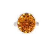 https://www.ross-simons.com/997682.htmlnnC. 2000. Youll be able to feel the uplifting effects of this Estate collection ring almost instantly! A 9.25 carat round citrine takes center stage, while a trail of icy 2.25 ct. t.w. round diamonds radiates along the band, elevating its warm amber hue. Crafted in 18kt white gold. 5/8 wide. Diamond and citrine ring. Exclusive, one-of-a-kind Estate Jewelry.