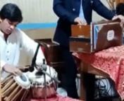 Noman Jani sings worship song Saina Da Yahowa and plays the harmonium. FGA Church in Pakistan.