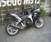 Black Honda CBR250R 2011 Motorcycle Modified With Two Brothers Black Series Carbon Fiber Exhaust.