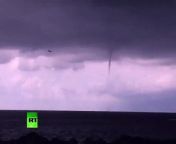 A plane was filmed landing in the Russian city of Sochi with three tornadoes right behind it. Up to twelve tornadoes were spotted off the coast on the same day, and it is the second week in a row that the columns have ripped through the Black Sea.