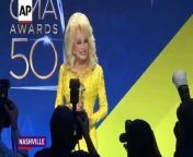 Dolly Parton, Eric Church and Garth Brooks celebrate their top wins backstage at the 50th CMA Awards in Nashville.