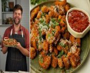 Chicken parm for dinner, but make it bite-sized! In this video, Matthew Francis makes the dangerously delicious recipe for Crispy Parmesan Chicken Bites with a rich marinara dipping sauce. This easy chicken dish achieves a crispy texture from broiling in the oven, as opposed to using a deep-fryer. With a seasoned, cheesy breading, Crispy Parmesan Chicken Bites are an enjoyable meal that every member of your family will love.