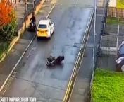 &#60;p&#62;Police have released footage of the moment a man fell off a scooter while trying to kick the wing mirror of a police car in Wrexham, North Wales.&#60;/p&#62;