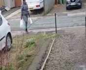 In this comical video, a woman showcases her impressive balancing skills by carrying luggage on her head, reminiscent of the traditional practice seen in village settings. The humorous aspect arises from the fact that her hands are already occupied, prompting her to resort to this unconventional but effective method of transport. The video captures the intersection of practicality and humor as the woman skillfully manages her load. It serves as a lighthearted and amusing moment, highlighting the ingenuity that people often display in everyday situations.&#60;br/&#62;Location: Leeds city, united kingdom &#60;br/&#62;WooGlobe Ref : WGA765089&#60;br/&#62;For licensing and to use this video, please email licensing@wooglobe.com