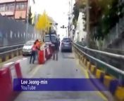 A driver in South Korea has a near miss after swerving out of the way of a truck which is rolling into oncoming traffic.