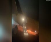 This video shows passengers escaping a Boeing 737 which caught fire and skidded off a runway in Senegal.&#60;br/&#62;&#60;br/&#62;Ten people were injured after the incident at Dakar airport on Thursday, according to local authorities.&#60;br/&#62;&#60;br/&#62;Passengers described “complete panic” as they jumped down the emergency slides while flames engulfed one side of the aircraft.&#60;br/&#62;&#60;br/&#62;The Air Senegal flight was headed to neighbouring Mali with 79 passengers, two pilots, and four cabin crew aboard.&#60;br/&#62;&#60;br/&#62;The cause of the fire remains unknown.&#60;br/&#62;&#60;br/&#62;The footage was captured by Malian musician Cheick Siriman Sissoko.